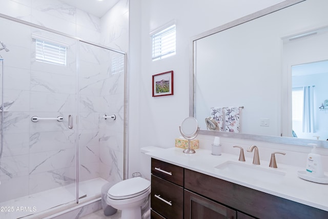 2513 E Pleasant Ln, Phoenix, AZ 85042 - bathroom featuring toilet, a marble finish shower, and plenty of natural light