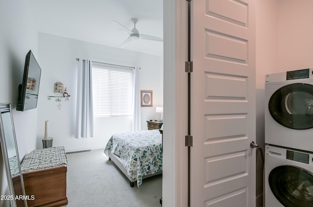 2513 E Pleasant Ln, Phoenix, AZ 85042 - bedroom featuring stacked washer / dryer, carpet, and ceiling fan