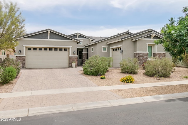 2513 E Pleasant Ln, Phoenix, AZ 85042 - craftsman inspired home featuring stone siding, stucco siding, an attached garage, and decorative driveway