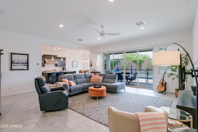 2513 E Pleasant Ln, Phoenix, AZ 85042 - living area with a ceiling fan, light tile patterned flooring, baseboards, and recessed lighting