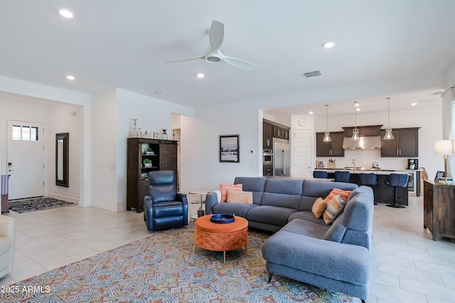 2513 E Pleasant Ln, Phoenix, AZ 85042 - living area featuring light tile patterned floors, recessed lighting, and ceiling fan