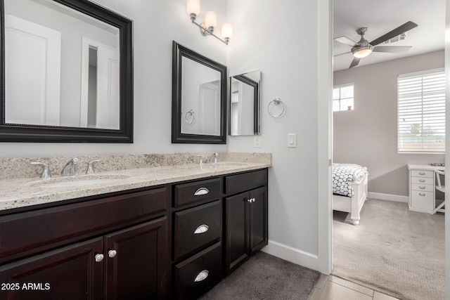 bathroom with ceiling fan, tile patterned flooring, and vanity