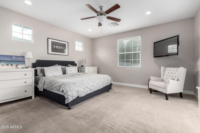 bedroom featuring ceiling fan and light colored carpet