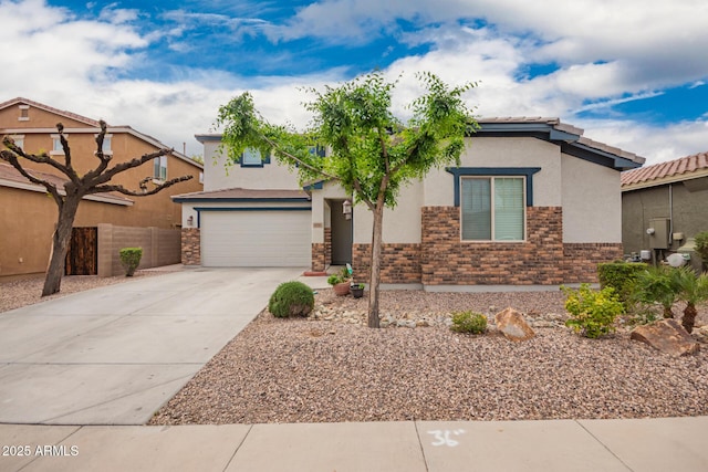 view of front of house with driveway, stucco siding, fence, brick siding, and a garage