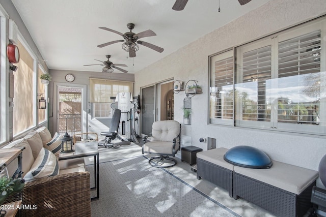 sunroom with a ceiling fan