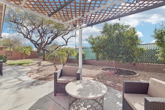 view of patio / terrace with a fenced backyard and a pergola