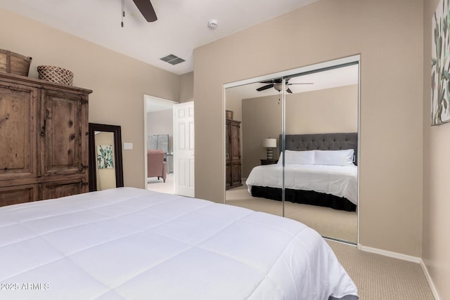 carpeted bedroom featuring baseboards, visible vents, ceiling fan, and a closet