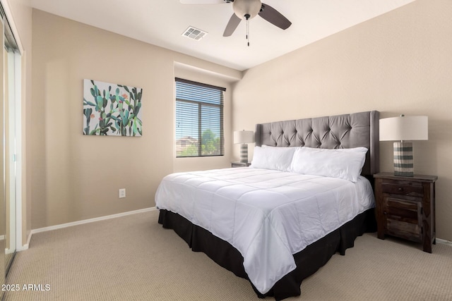 carpeted bedroom featuring baseboards, visible vents, and ceiling fan