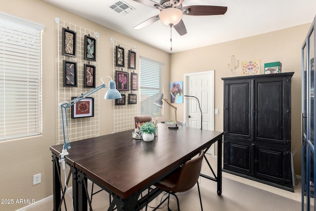 dining space featuring visible vents, ceiling fan, and baseboards