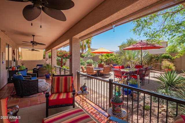 view of patio / terrace featuring outdoor lounge area, outdoor dining area, a ceiling fan, and a fenced backyard
