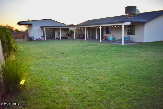 4755 E Gary St, Mesa, AZ 85205 - rear view of property with a patio area, a lawn, and stucco siding