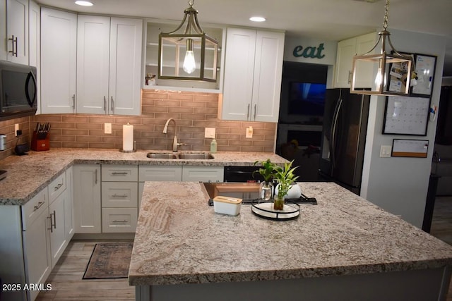 4755 E Gary St, Mesa, AZ 85205 - kitchen with black appliances, white cabinetry, a kitchen island, and recessed lighting