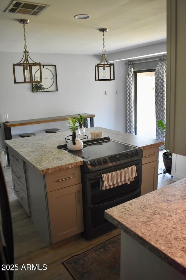 4755 E Gary St, Mesa, AZ 85205 - kitchen featuring black electric range oven, dark wood-style floors, a center island, and hanging light fixtures