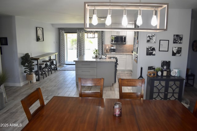 4755 E Gary St, Mesa, AZ 85205 - dining room featuring light wood-style flooring