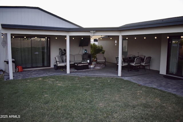 4755 E Gary St, Mesa, AZ 85205 - back of property with a patio, outdoor lounge area, a yard, and stucco siding