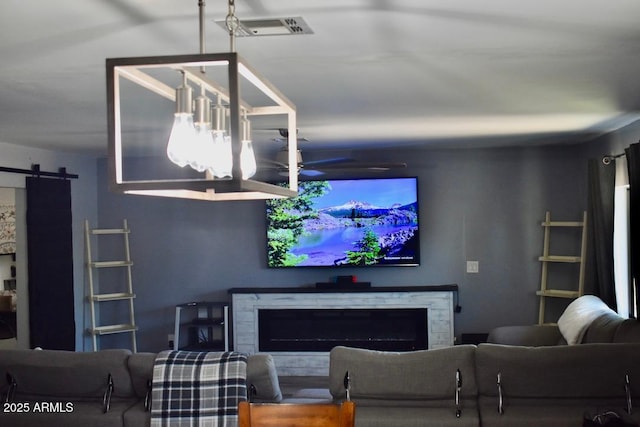 4755 E Gary St, Mesa, AZ 85205 - living room featuring a barn door and a premium fireplace