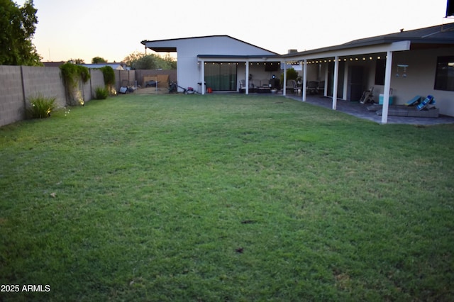 4755 E Gary St, Mesa, AZ 85205 - yard at dusk with a fenced backyard and a patio
