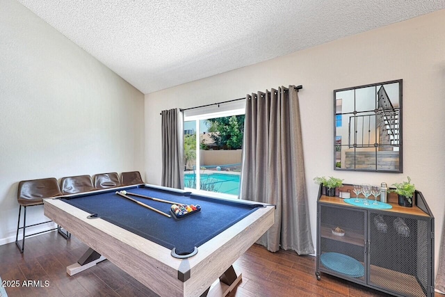 rec room with billiards, a textured ceiling, and wood finished floors