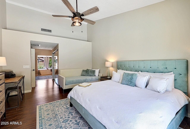 bedroom with baseboards, a ceiling fan, visible vents, and dark wood finished floors
