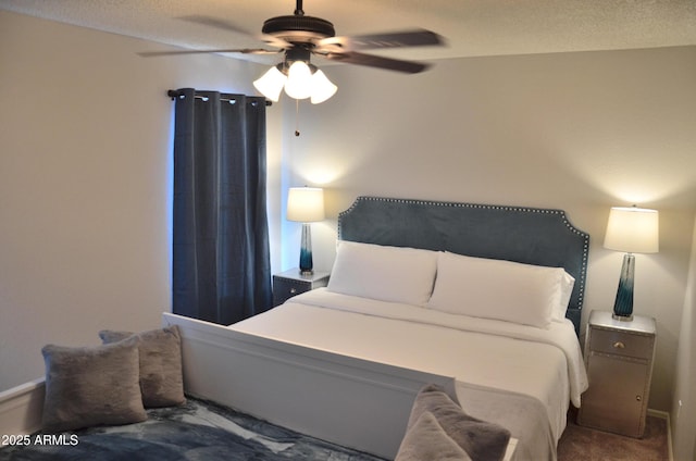 bedroom featuring a textured ceiling, carpet, and a ceiling fan