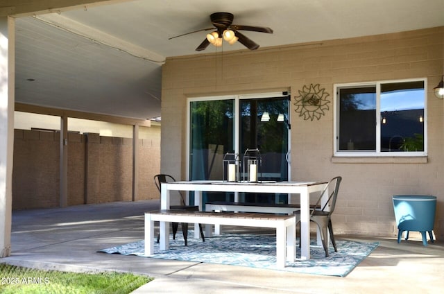 view of patio with a ceiling fan and outdoor dining area