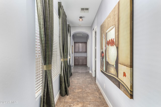 corridor featuring tile patterned flooring