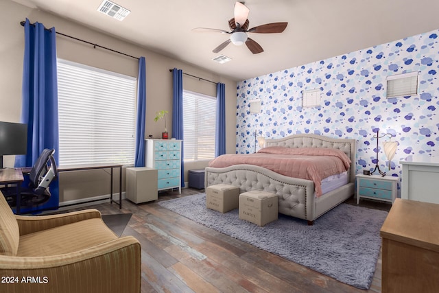 bedroom featuring wood-type flooring and ceiling fan