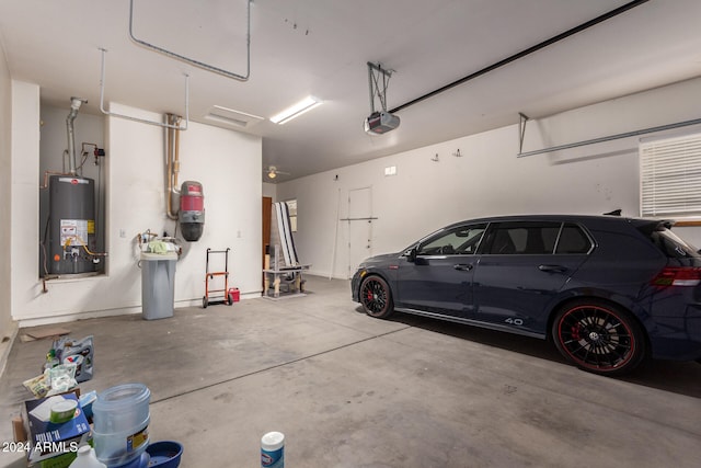 garage with a garage door opener and gas water heater