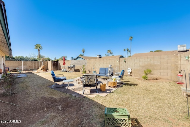 view of yard featuring a patio area and a fenced backyard