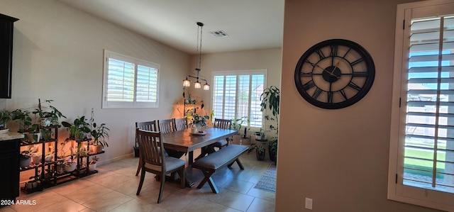 dining room with plenty of natural light and light tile patterned flooring