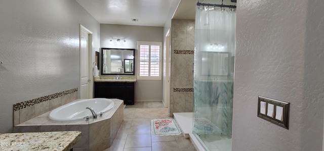 bathroom with tile patterned floors, independent shower and bath, and vanity