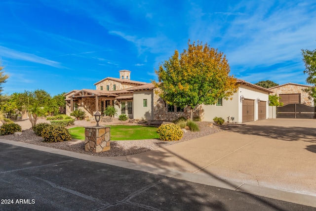 mediterranean / spanish home with a garage