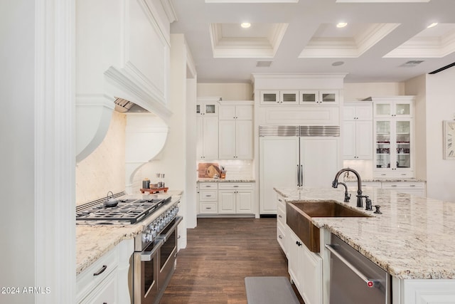 kitchen featuring sink, dark hardwood / wood-style flooring, backsplash, high quality appliances, and white cabinets