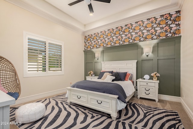 bedroom with ceiling fan and ornamental molding