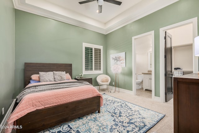 carpeted bedroom with ceiling fan, crown molding, and connected bathroom