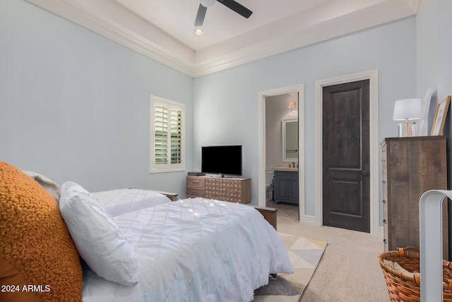 bedroom featuring ensuite bathroom, ceiling fan, and light carpet