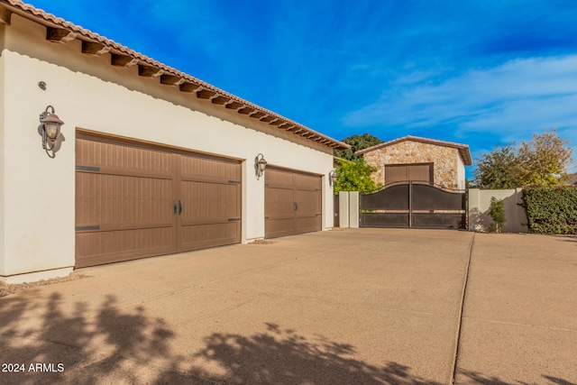 view of side of property with a garage