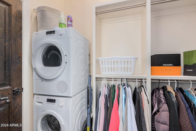 laundry area with stacked washer / dryer