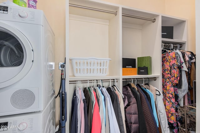 closet featuring stacked washing maching and dryer