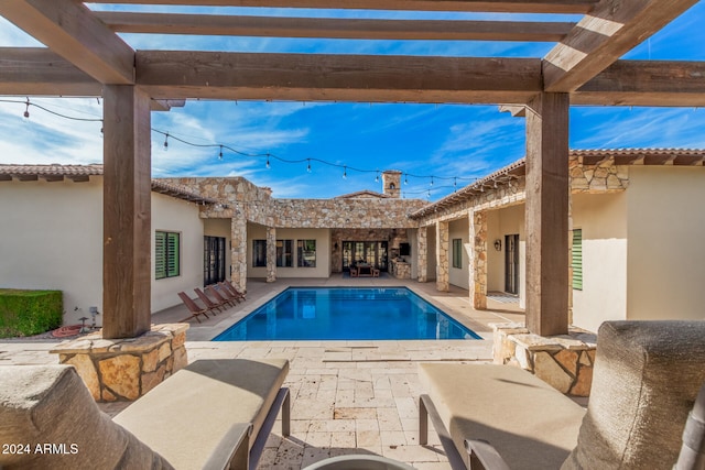 view of swimming pool with a patio area