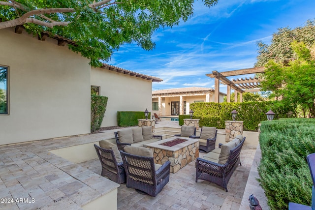 view of patio / terrace featuring an outdoor living space with a fire pit