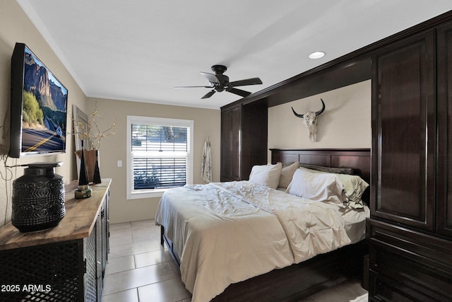 bedroom featuring light tile patterned floors and ceiling fan