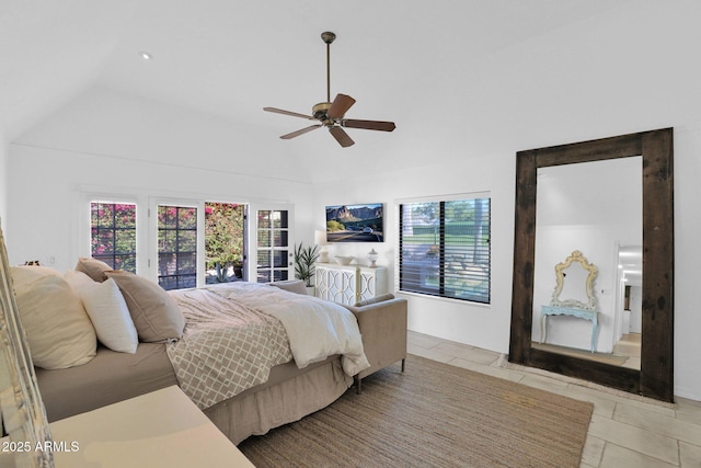 tiled bedroom featuring ceiling fan and lofted ceiling