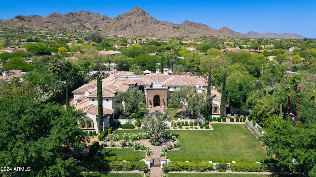 birds eye view of property with a mountain view