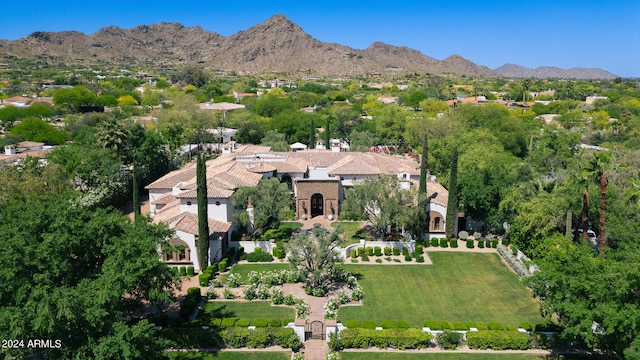 birds eye view of property with a mountain view