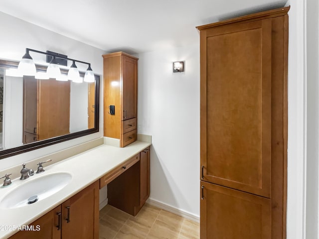 bathroom with vanity and baseboards