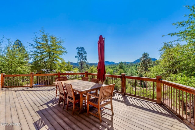 wooden deck featuring a mountain view