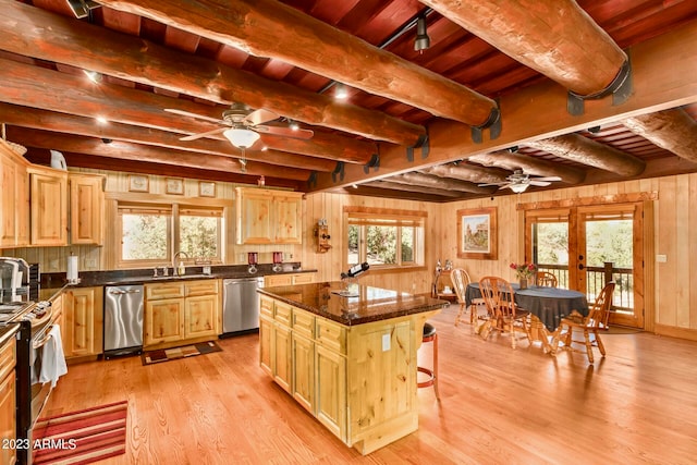 kitchen featuring a center island, light hardwood / wood-style floors, wood ceiling, beam ceiling, and stainless steel appliances