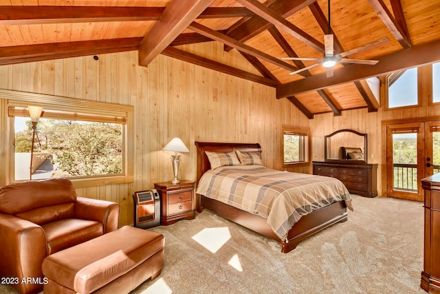 bedroom featuring beam ceiling, access to exterior, and carpet floors