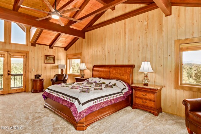 bedroom with lofted ceiling with beams, carpet flooring, access to outside, wooden ceiling, and wood walls